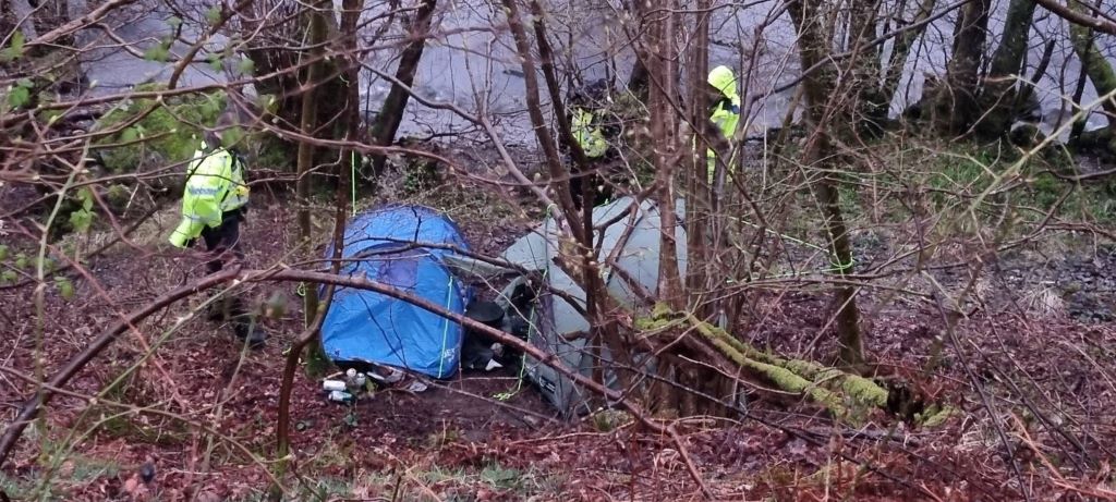 Fly-campers forced to clean site in heavy rain after crackdown